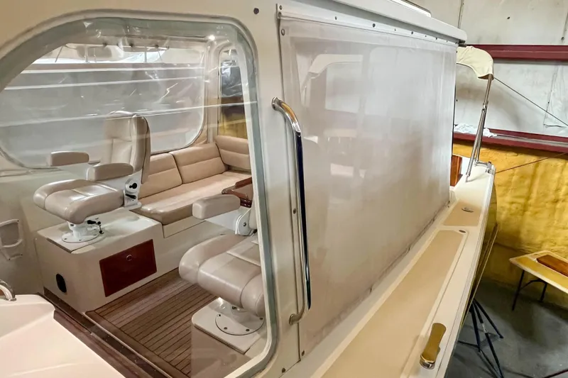  Yacht Photos Pics 2009 MJM 34z Downeast boat interior with beige seating and wooden accents.