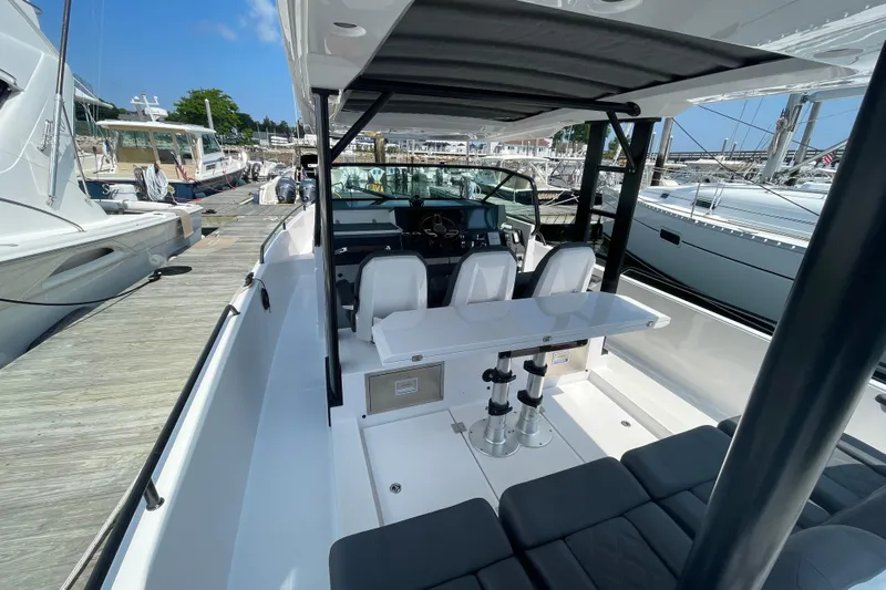  Yacht Photos Pics 2020 Axopar 37 SUN TOP BRABUS boat docked, featuring sleek seating and modern design.