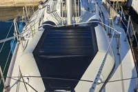 Sailboat deck view, Custom Enter Explicite 360, docked at marina, sunny day.