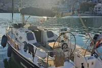 Sailboat "Enter explicite 360" docked in a scenic harbor at sunset, 1999 model.