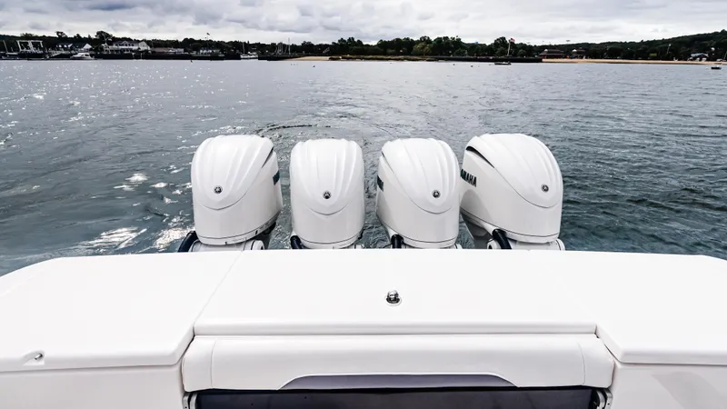  Yacht Photos Pics Four powerful outboard engines on a 2017 Everglades 435 CC boat, cruising on calm waters.