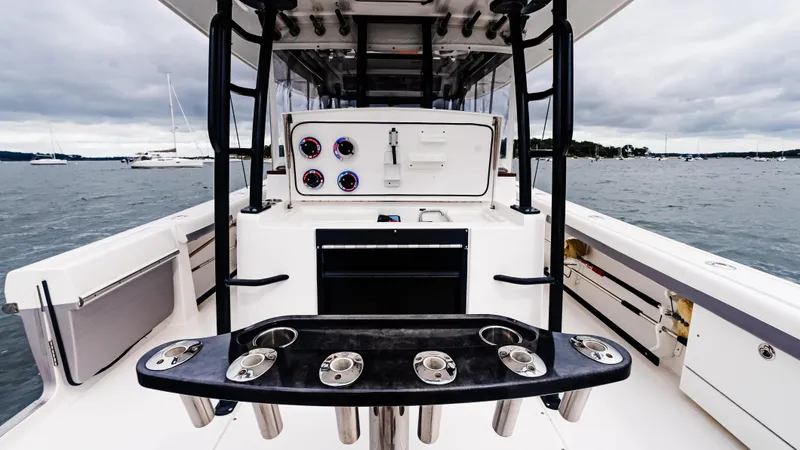  Yacht Photos Pics 2017 Everglades 435 CC boat interior with fishing rod holders and control panel.