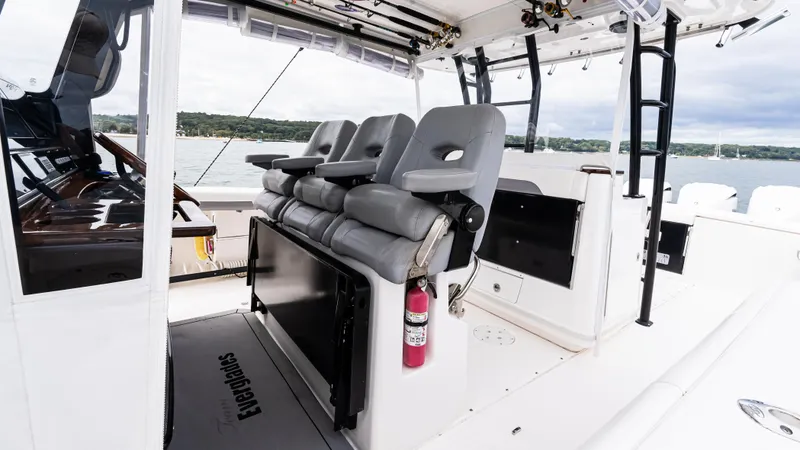  Yacht Photos Pics 2017 Everglades 435 CC boat interior with gray seating and safety equipment.