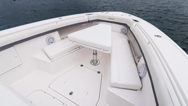  Yacht Photos Pics 2017 Everglades 435 CC boat interior with seating and table on calm water.