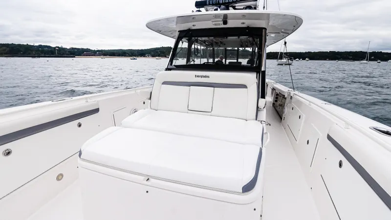  Yacht Photos Pics 2017 Everglades 435 CC boat on water, featuring spacious deck and seating.