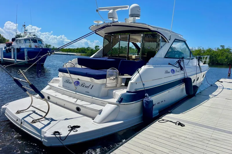  Yacht Photos Pics 2011 Regal 46 Sport Coupe yacht docked on a sunny day.