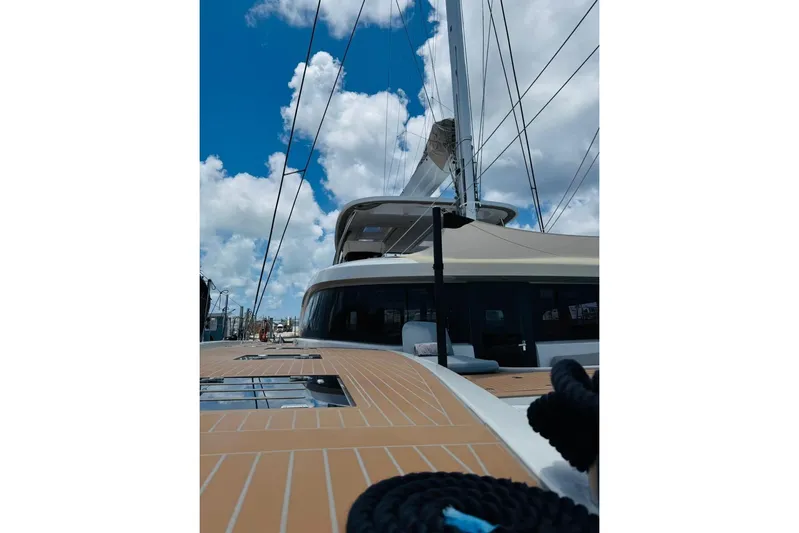 El Nino Yacht Photos Pics 2024 Lagoon 65 yacht deck under blue sky with clouds.