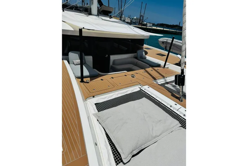 El Nino Yacht Photos Pics 2024 Lagoon 65 yacht deck with seating and sunbathing area.