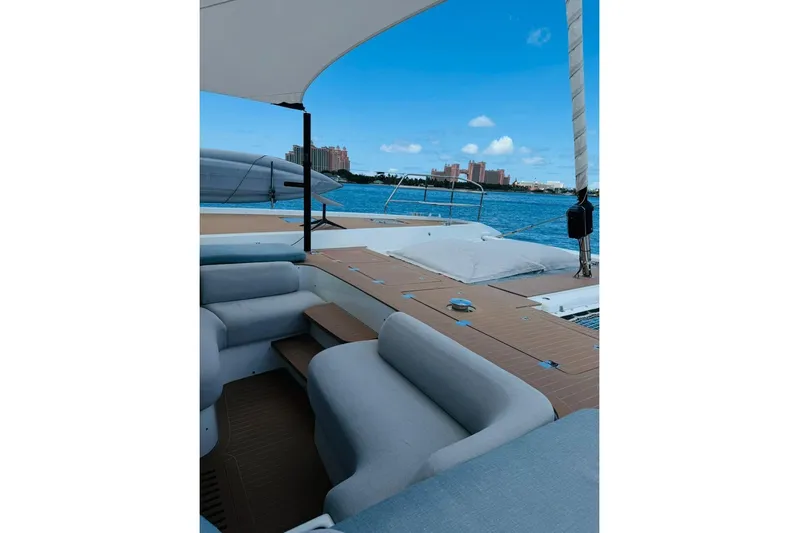 El Nino Yacht Photos Pics Luxurious 2024 Lagoon 65 yacht deck with comfortable seating and ocean view.