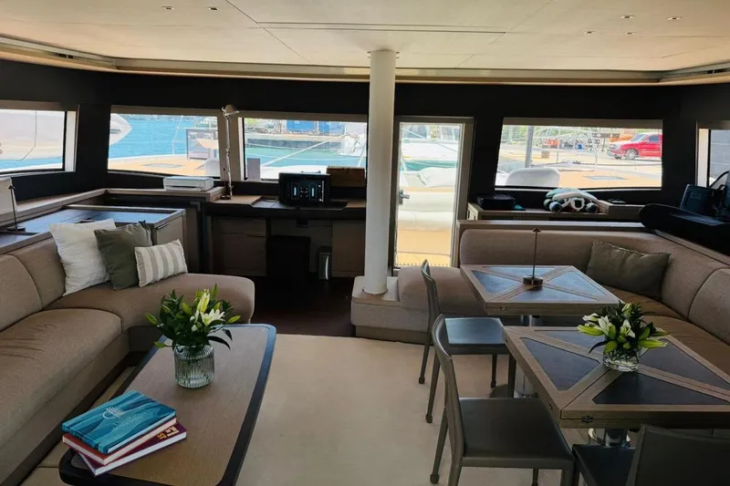 El Nino Yacht Photos Pics Luxurious interior of 2024 Lagoon 65 yacht with elegant seating and decor.