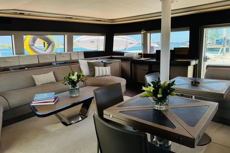 El Nino Yacht Photos Pics Luxurious interior of 2024 Lagoon 65 yacht with elegant seating and modern decor.