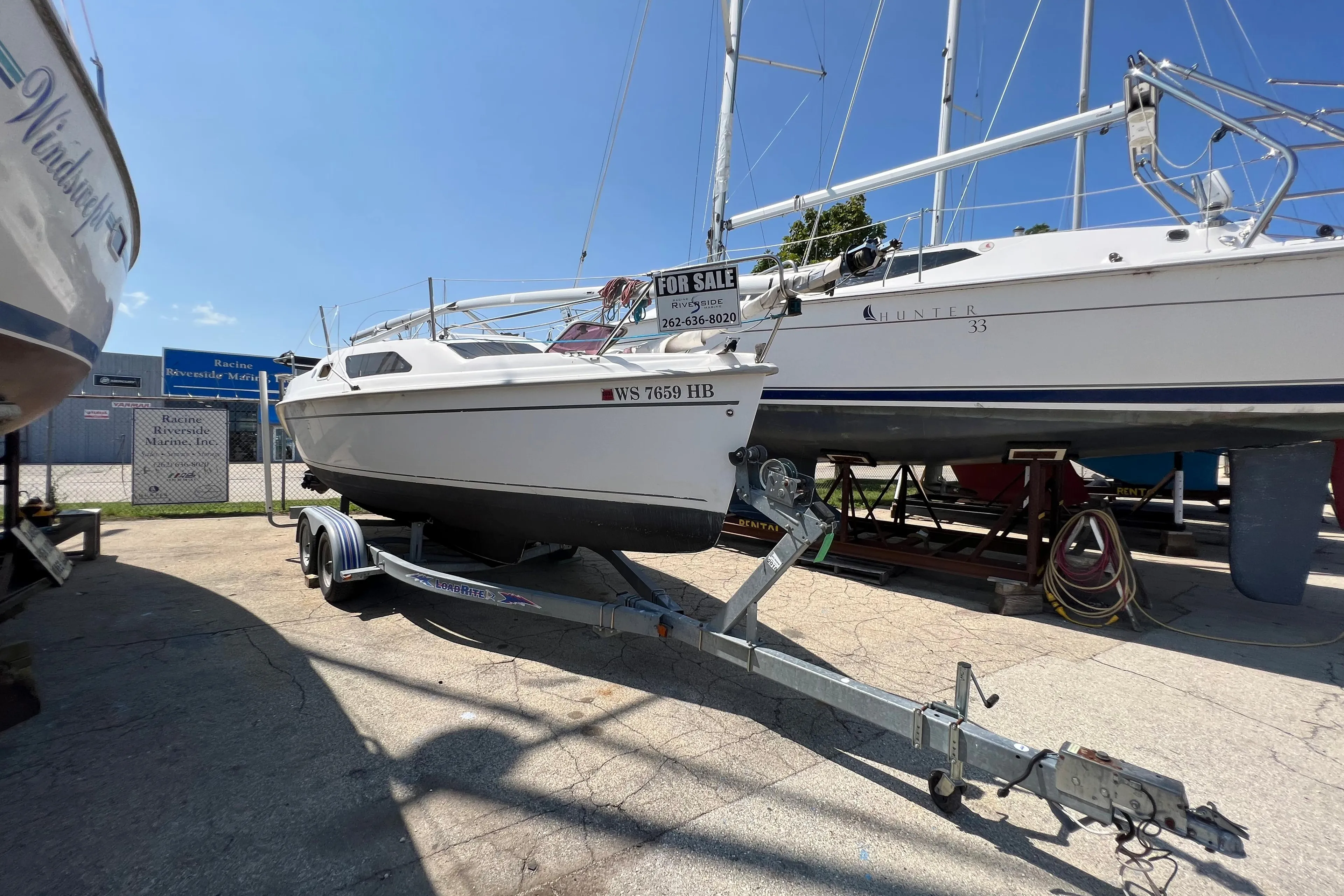 2007 Hunter 25 sailboat on trailer, for sale at marina.