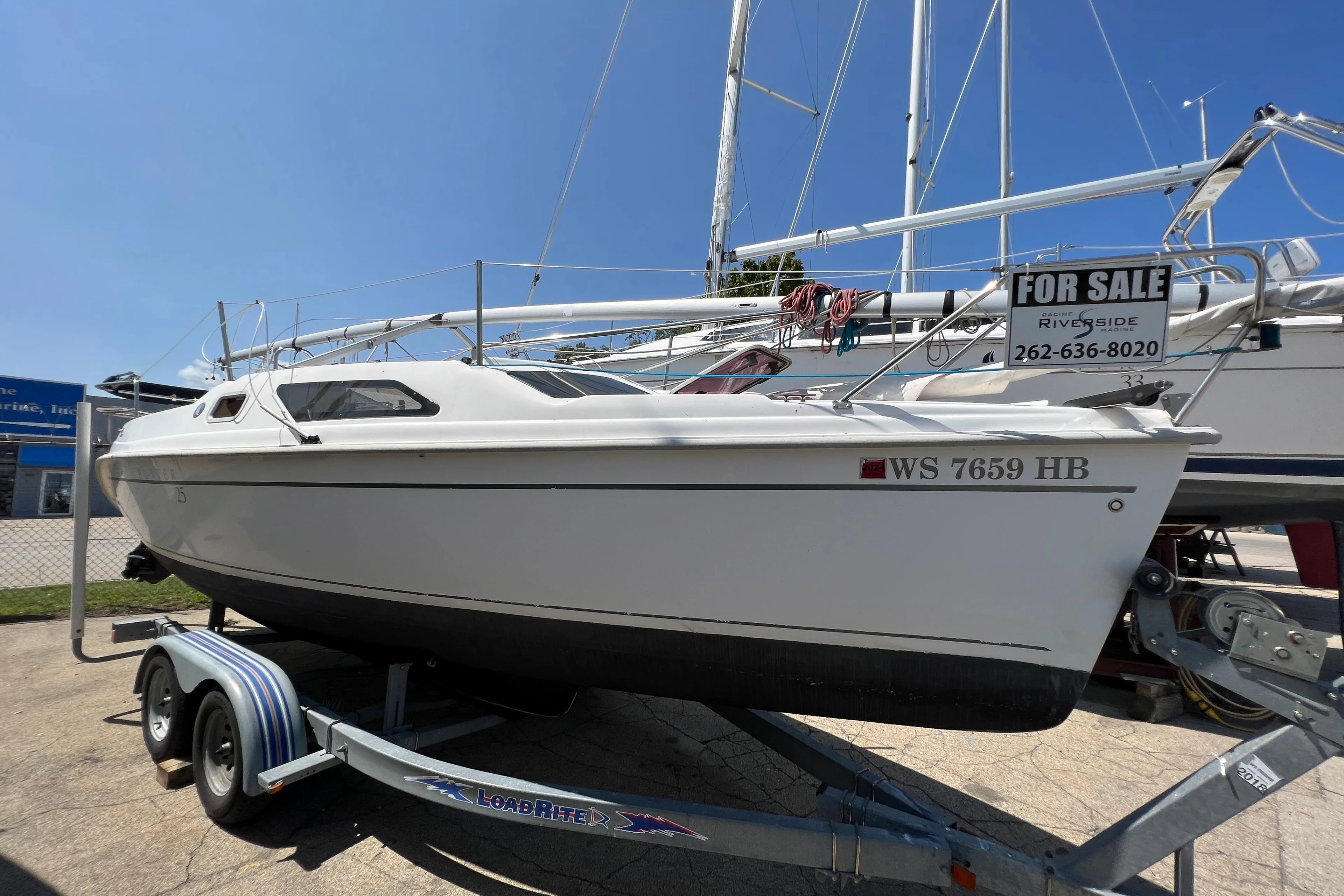 2007 Hunter 25 sailboat on trailer, for sale, sunny day.