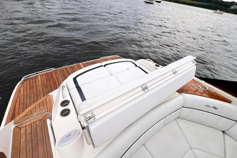  Yacht Photos Pics 2014 Sea Ray SLX 350 boat with luxurious seating and wooden deck on a lake.