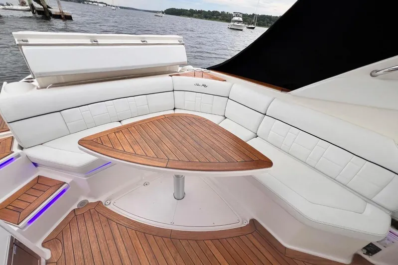  Yacht Photos Pics Luxurious 2014 Sea Ray SLX 350 boat with elegant white seating and wooden table.