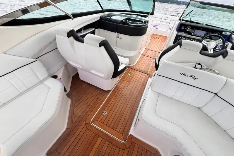  Yacht Photos Pics 2014 Sea Ray SLX 350 boat interior with white seating and wooden flooring.