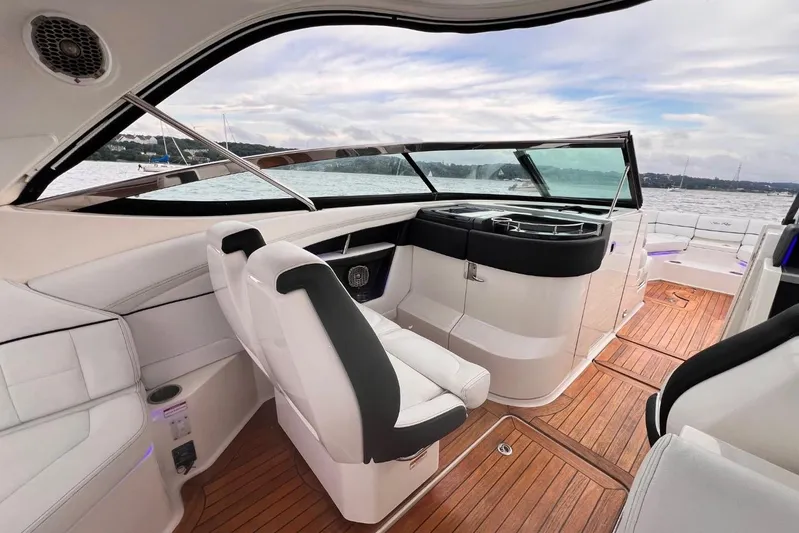  Yacht Photos Pics 2014 Sea Ray SLX 350 boat interior with sleek seating and wooden flooring.