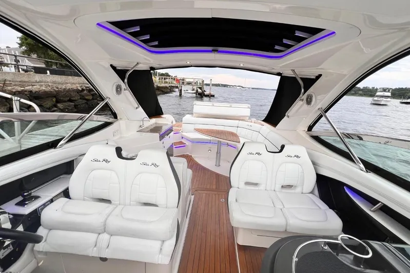  Yacht Photos Pics 2014 Sea Ray SLX 350 boat interior with luxurious seating and wood flooring.