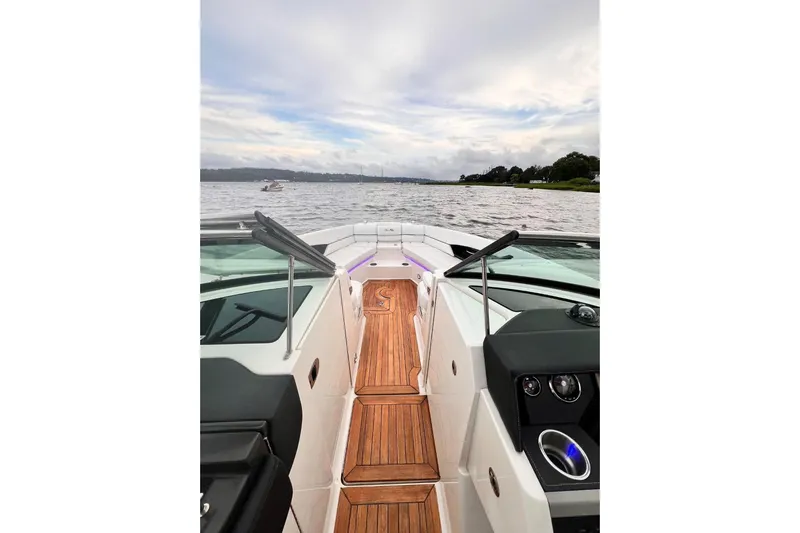  Yacht Photos Pics 2014 Sea Ray SLX 350 boat interior with wooden deck, cruising on a calm lake.