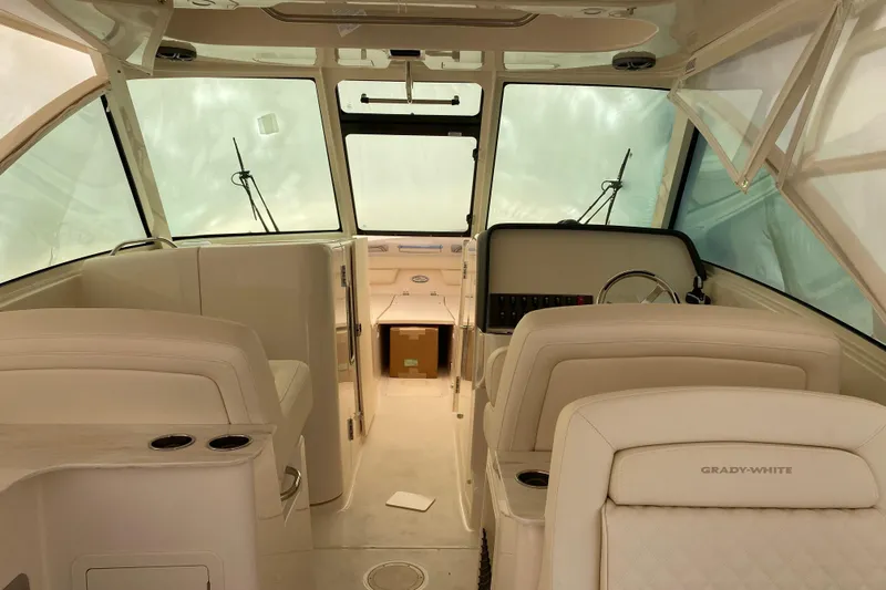  Yacht Photos Pics Interior of 2026 Grady-White Freedom 325 boat, featuring luxurious seating and helm.