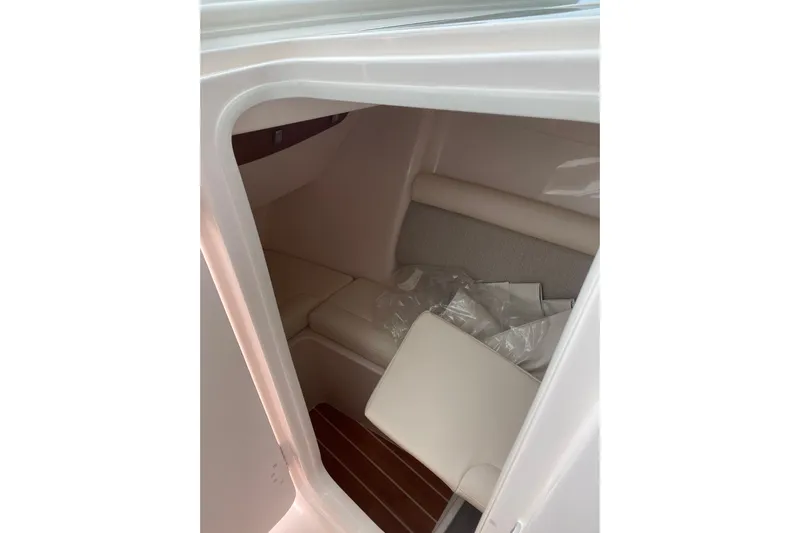 Yacht Photos Pics Interior cabin of 2026 Grady-White Freedom 325 boat, featuring cushioned seating.