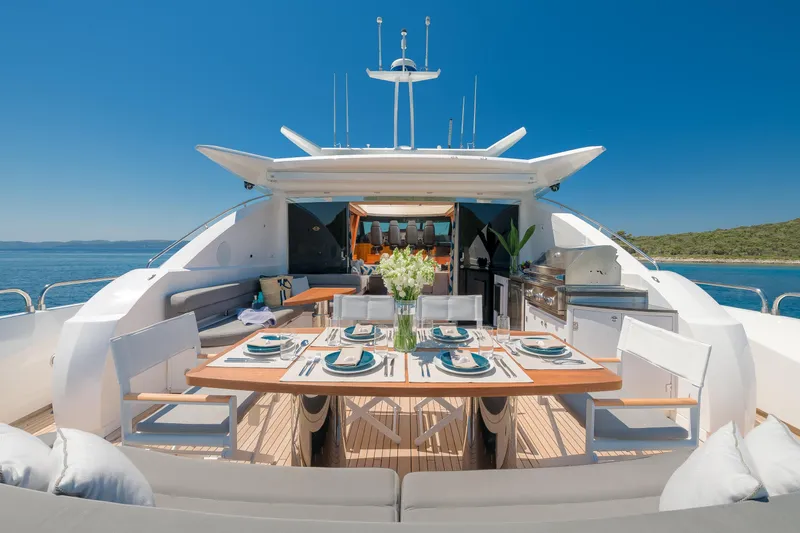  Yacht Photos Pics Luxurious 2008 Sunseeker Predator 108 yacht with elegant outdoor dining setup.