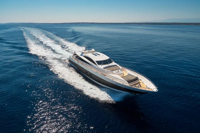  Yacht Photos Pics Luxurious 2008 Sunseeker Predator 108 yacht cruising on open blue sea.