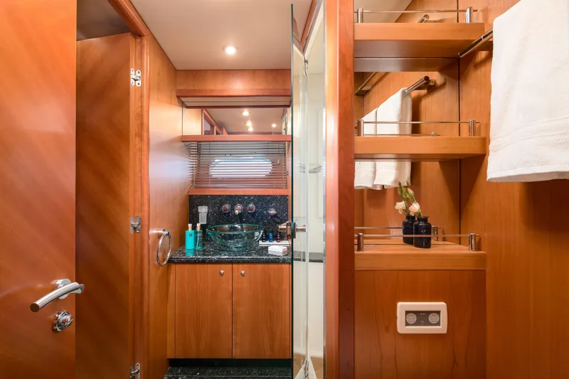  Yacht Photos Pics Luxurious bathroom interior of 2008 Sunseeker Predator 108 yacht with wood finishes and modern amenities.