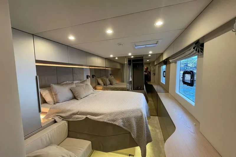 Ksenia Yacht Photos Pics Luxurious interior of 2024 Sunreef 60 yacht with elegant bedroom design.