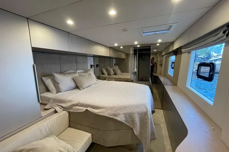 Ksenia Yacht Photos Pics Luxurious interior of 2024 Sunreef 60 yacht with elegant bedroom and modern design.