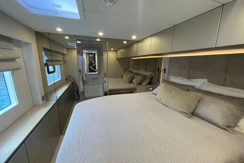 Ksenia Yacht Photos Pics Luxurious bedroom interior of 2024 Sunreef 60 yacht with modern design and elegant furnishings.