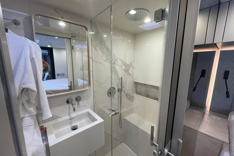 Ksenia Yacht Photos Pics Luxurious bathroom in 2024 Sunreef 60 yacht with modern shower and sleek design.