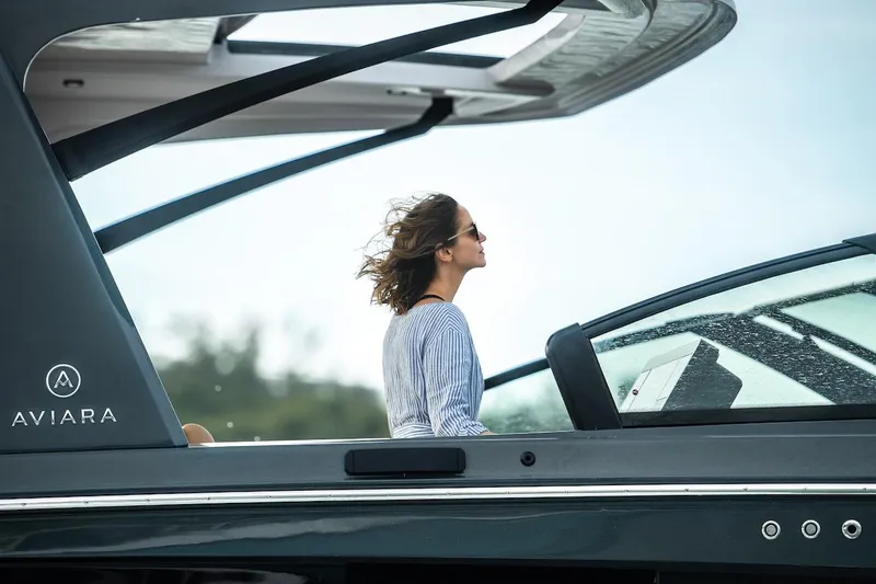  Yacht Photos Pics Manufacturer Provided Image: 2022 Aviara AV40 OB luxury boat with a woman enjoying the view.