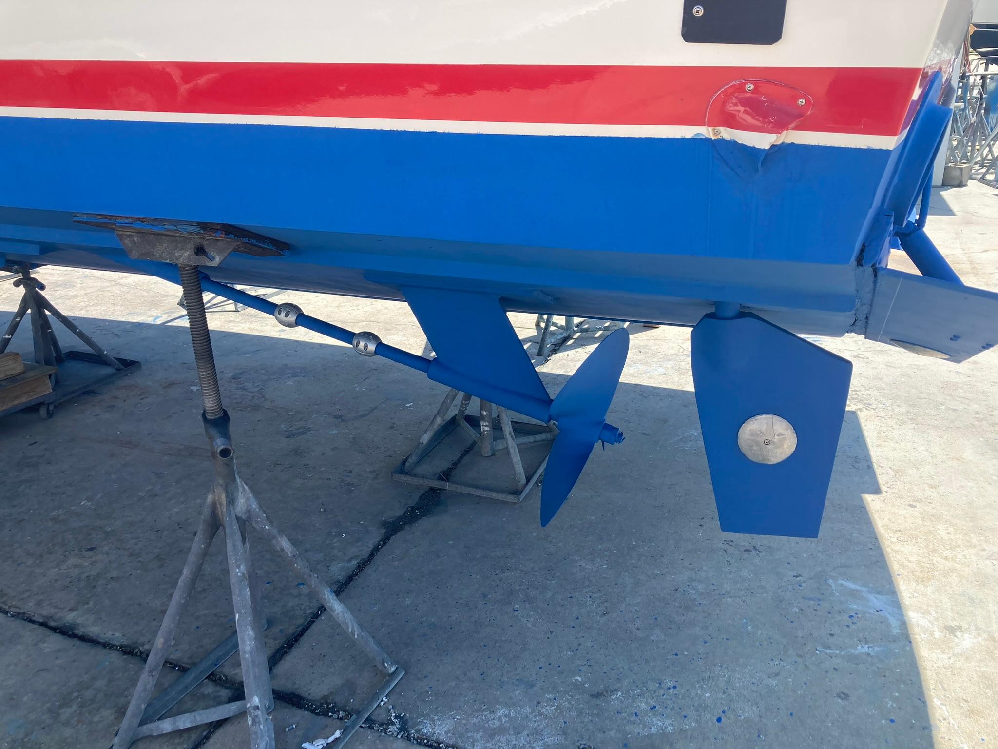 Close-up of the propeller and rudder of a 1975 Custom 36 Matlack Tournament SF boat.