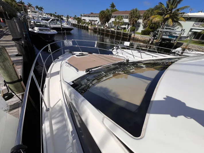  Yacht Photos Pics 2016 Sea Ray 400 Sundancer yacht docked in a sunny marina.