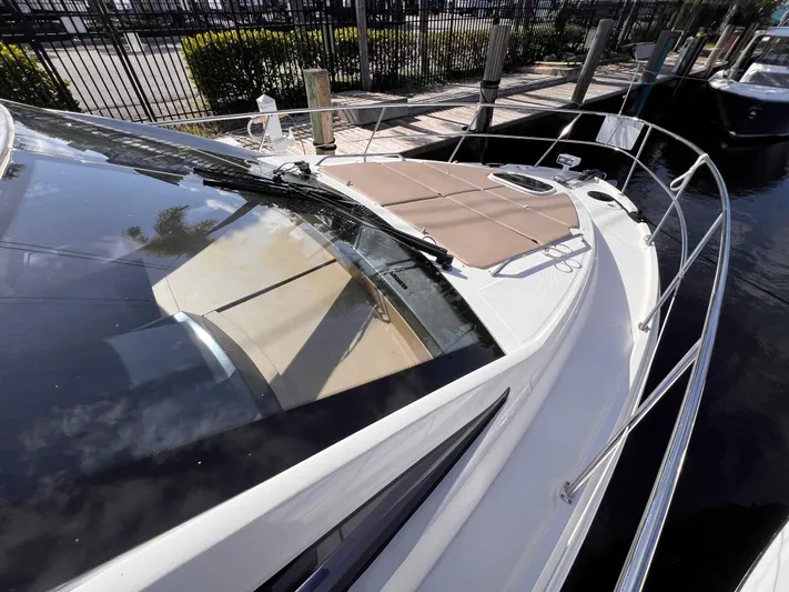  Yacht Photos Pics 2016 Sea Ray 400 Sundancer yacht docked, showcasing sleek design and spacious deck.