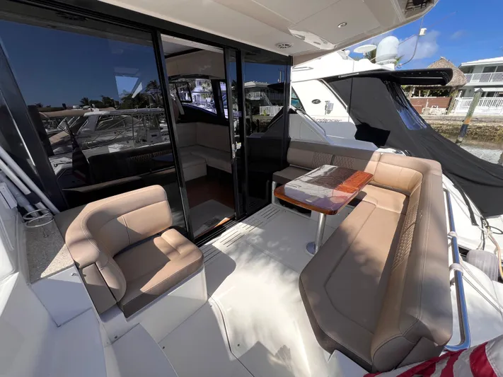  Yacht Photos Pics 2016 Sea Ray 400 Sundancer yacht with outdoor seating and table.