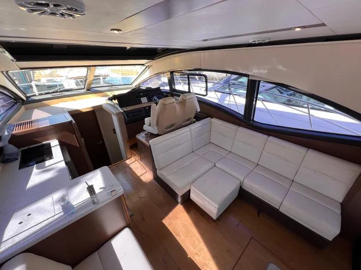  Yacht Photos Pics Interior of 2016 Sea Ray 400 Sundancer yacht with white leather seating and modern design.