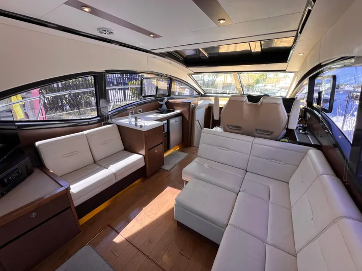  Yacht Photos Pics Luxurious interior of a 2016 Sea Ray 400 Sundancer yacht with elegant seating and modern design.