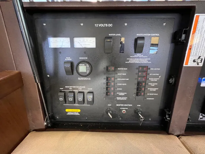  Yacht Photos Pics Control panel of a 2016 Sea Ray 400 Sundancer boat, featuring various switches and gauges.