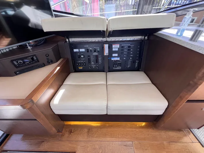  Yacht Photos Pics Electrical panel and seating area on 2016 Sea Ray 400 Sundancer yacht.