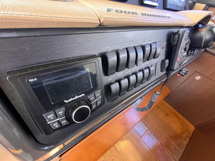  Yacht Photos Pics Control panel of 2016 Sea Ray 400 Sundancer yacht with switches and radio system.