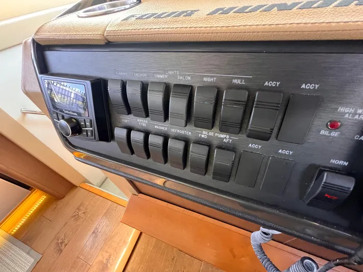  Yacht Photos Pics Control panel of a 2016 Sea Ray 400 Sundancer yacht with switches and dials.