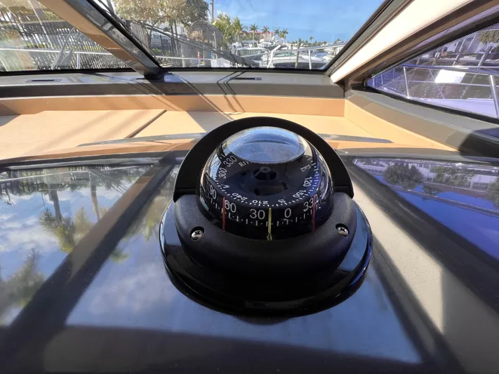  Yacht Photos Pics Compass on 2016 Sea Ray 400 Sundancer yacht, viewed through windshield.