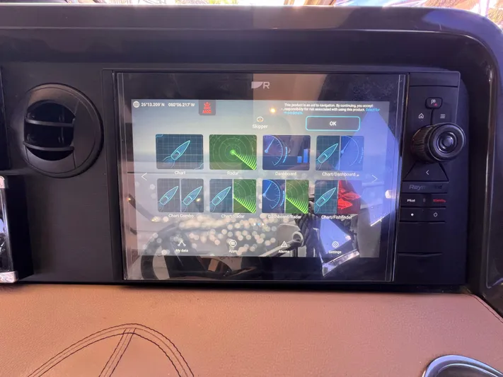  Yacht Photos Pics Dashboard of a 2016 Sea Ray 400 Sundancer with navigation display.