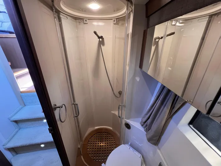  Yacht Photos Pics Bathroom interior of 2016 Sea Ray 400 Sundancer yacht with shower and toilet.
