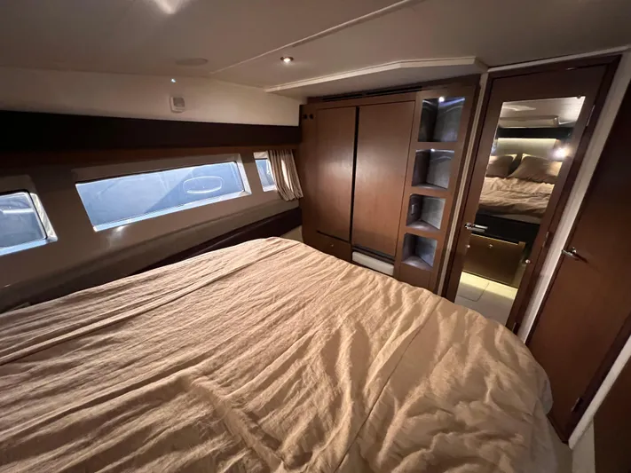  Yacht Photos Pics Luxurious cabin interior of 2016 Sea Ray 400 Sundancer yacht with cozy bedding.