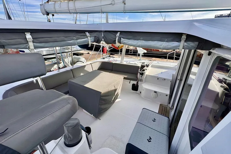Alegria Yacht Photos Pics 2017 Outremer 51 catamaran cockpit with seating and covered table.