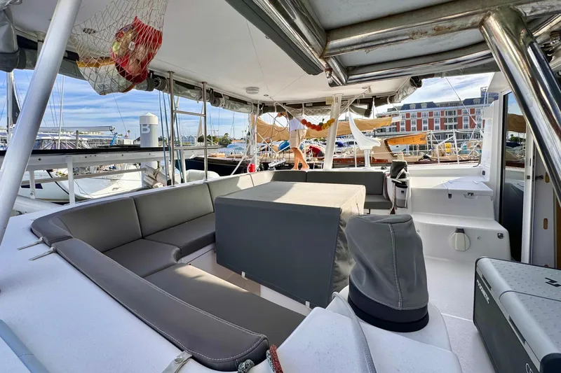 Alegria Yacht Photos Pics 2017 Outremer 51 yacht interior with seating and marina view.
