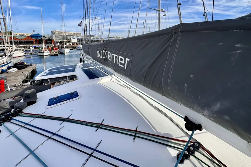 Alegria Yacht Photos Pics 2017 Outremer 51 catamaran docked at marina with solar panels and rigging.